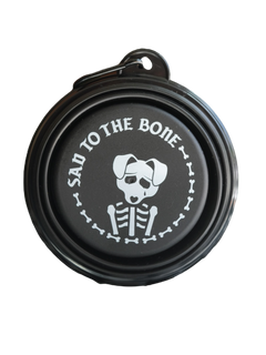 Collapsible dog bowl featuring a 'Sad to the Bone' emo design – a must-have travel accessory for pet lovers on the go.