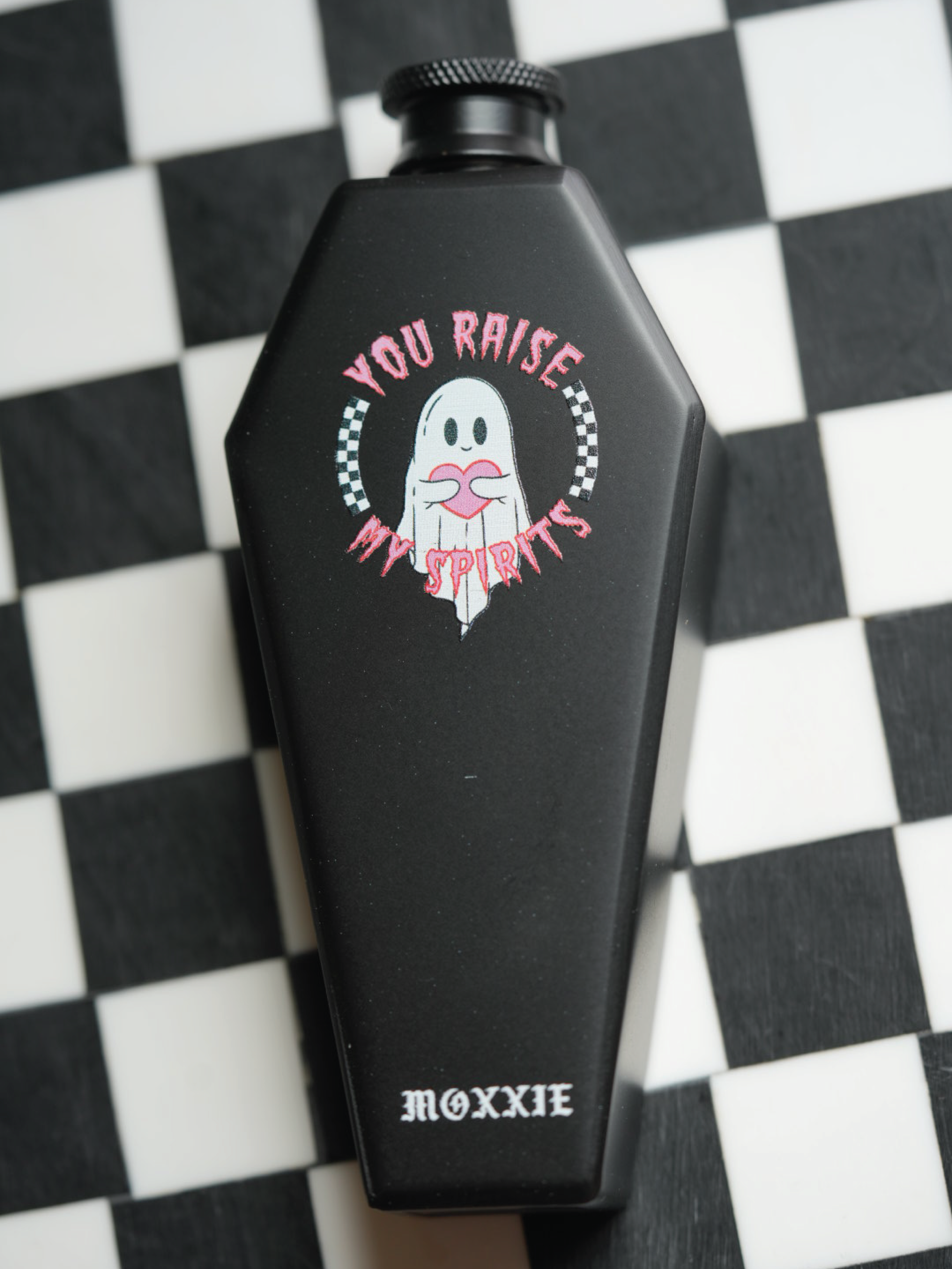 Emo-inspired coffin-shaped flask, perfect for goths and ghost lovers, bringing a spooky touch to your San Diego barware collection.