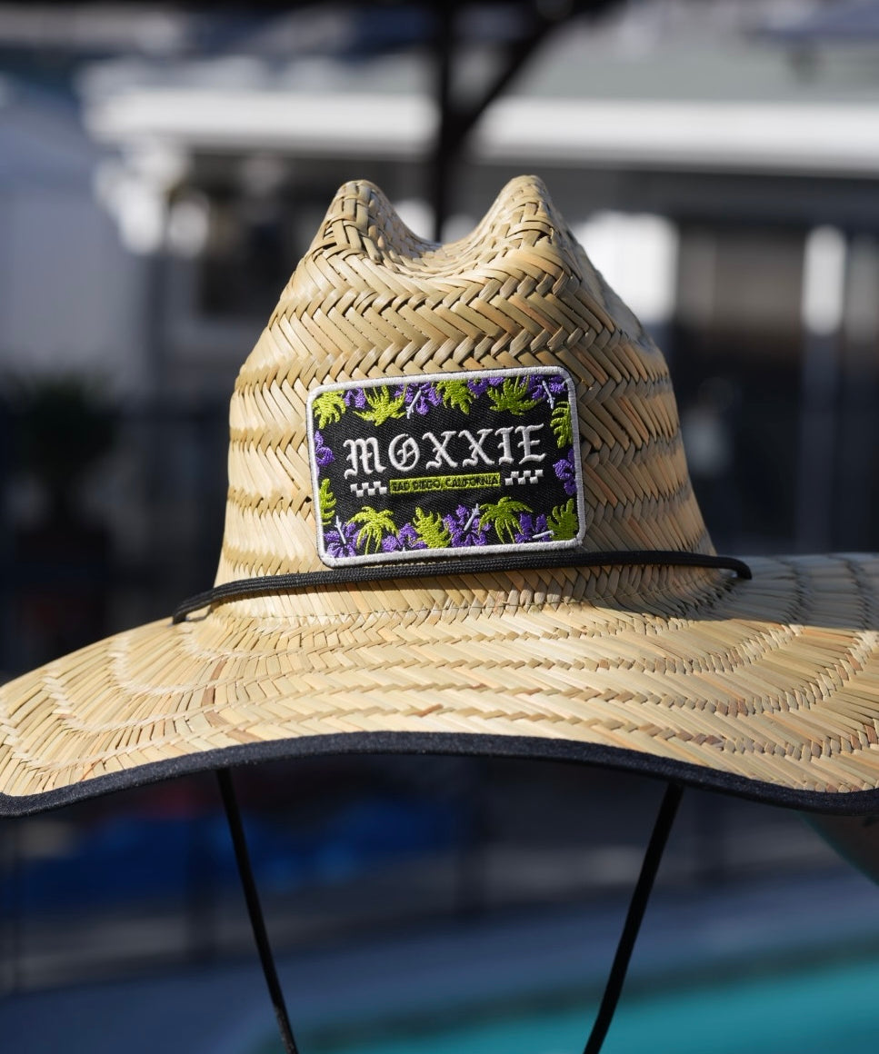 Tiki-inspired beach hat from Moxxie, featuring tattoo flash designs for a unique and stylish summer accessory.