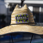 Tiki-inspired beach hat from Moxxie, featuring tattoo flash designs for a unique and stylish summer accessory.