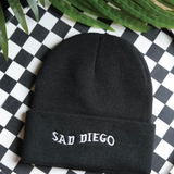 Stay cozy and emo with the black Sad Diego beanie – perfect for embracing your sad side at Emo Night.
