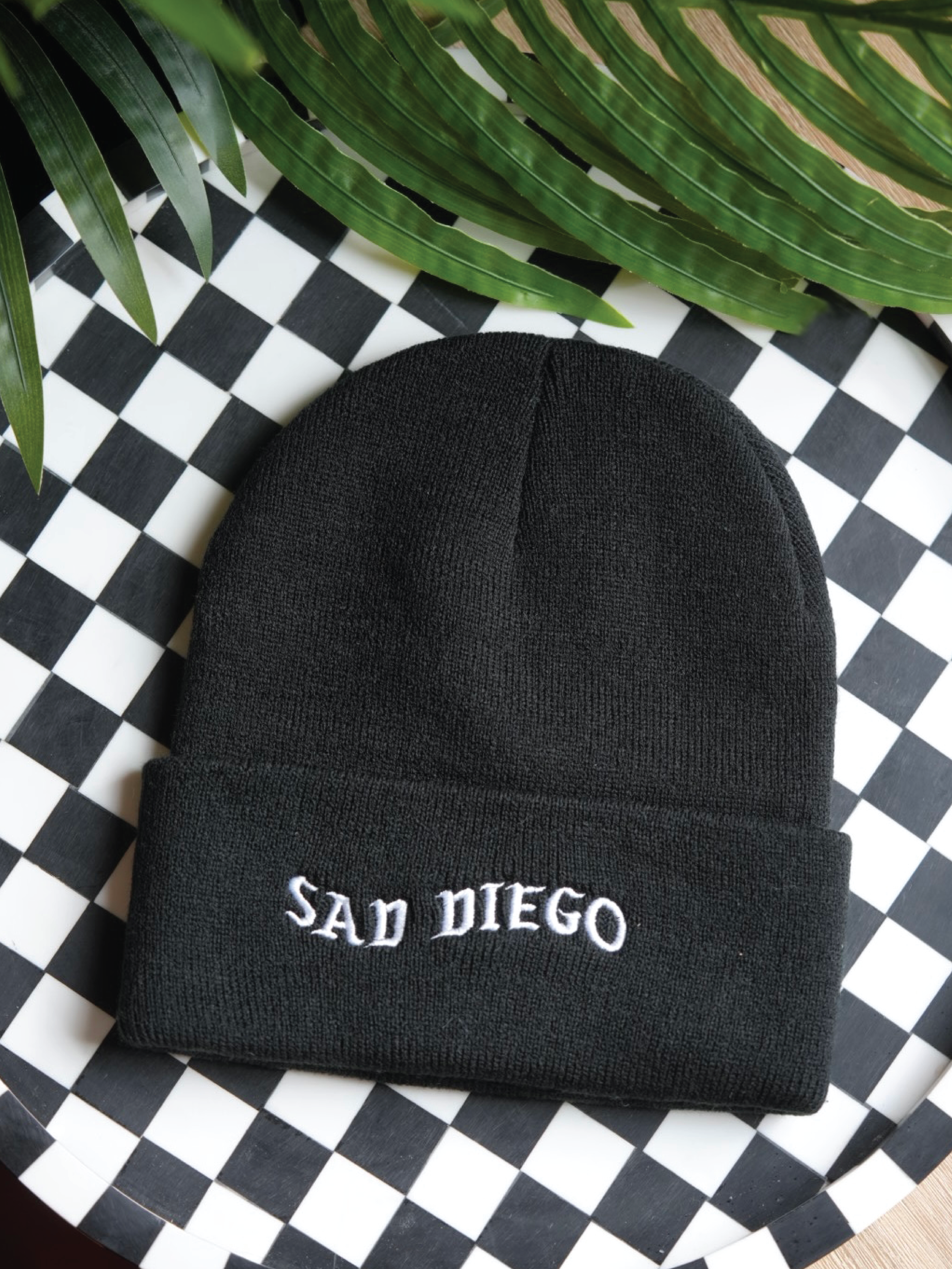 Stay cozy and emo with the black Sad Diego beanie – perfect for embracing your sad side at Emo Night.