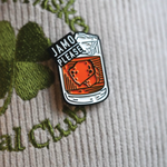 Jamo Please enamel pin on a hat, featuring Jameson Irish Whiskey design, ideal for St. Patrick's Day.