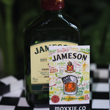 Jamo Please' enamel pin featuring Jameson bottle design, perfect for whiskey lovers and St. Patrick’s Day celebrations.