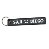 San Diego Emo night essential: Sad Diego woven keychain, the perfect blend of nostalgia and unique design.