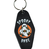 Spooky babe ghost keychain with a floral twist – a hauntingly cute addition to your collection of vintage-inspired accessories.