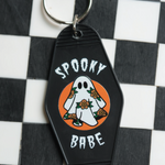 Unique spooky babe keychain featuring a ghost adorned with flowers, combining spooky vibes and vintage charm in one keychain. 