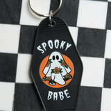 Unique spooky babe keychain featuring a ghost adorned with flowers, combining spooky vibes and vintage charm in one keychain. 