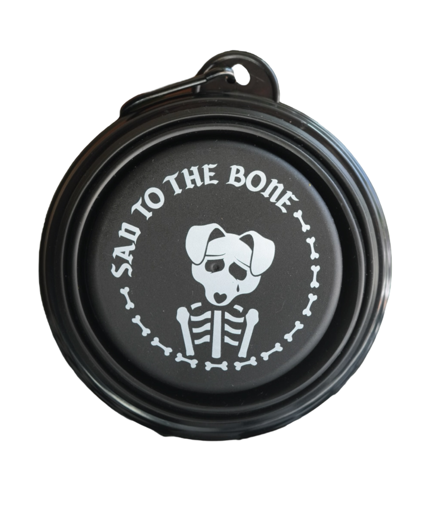 Collapsible dog bowl featuring a 'Sad to the Bone' emo design – a must-have travel accessory for pet lovers on the go.
