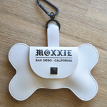 Compact and convenient, the Moxxie White Leather Poop Bag Pouch is designed for easy bag retrieval and replacement, with stylish matte black details.