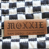 Moxxie stylish branded leather label. Moxxie Pet Sling Carrier – the perfect blend of style and function for pet lovers on the move.