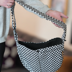 Hands-free comfort with the Moxxie Pet Sling Carrier – perfect for keeping your pet close and cozy on the go. Checkered pattern is perfect for emo vibes. 