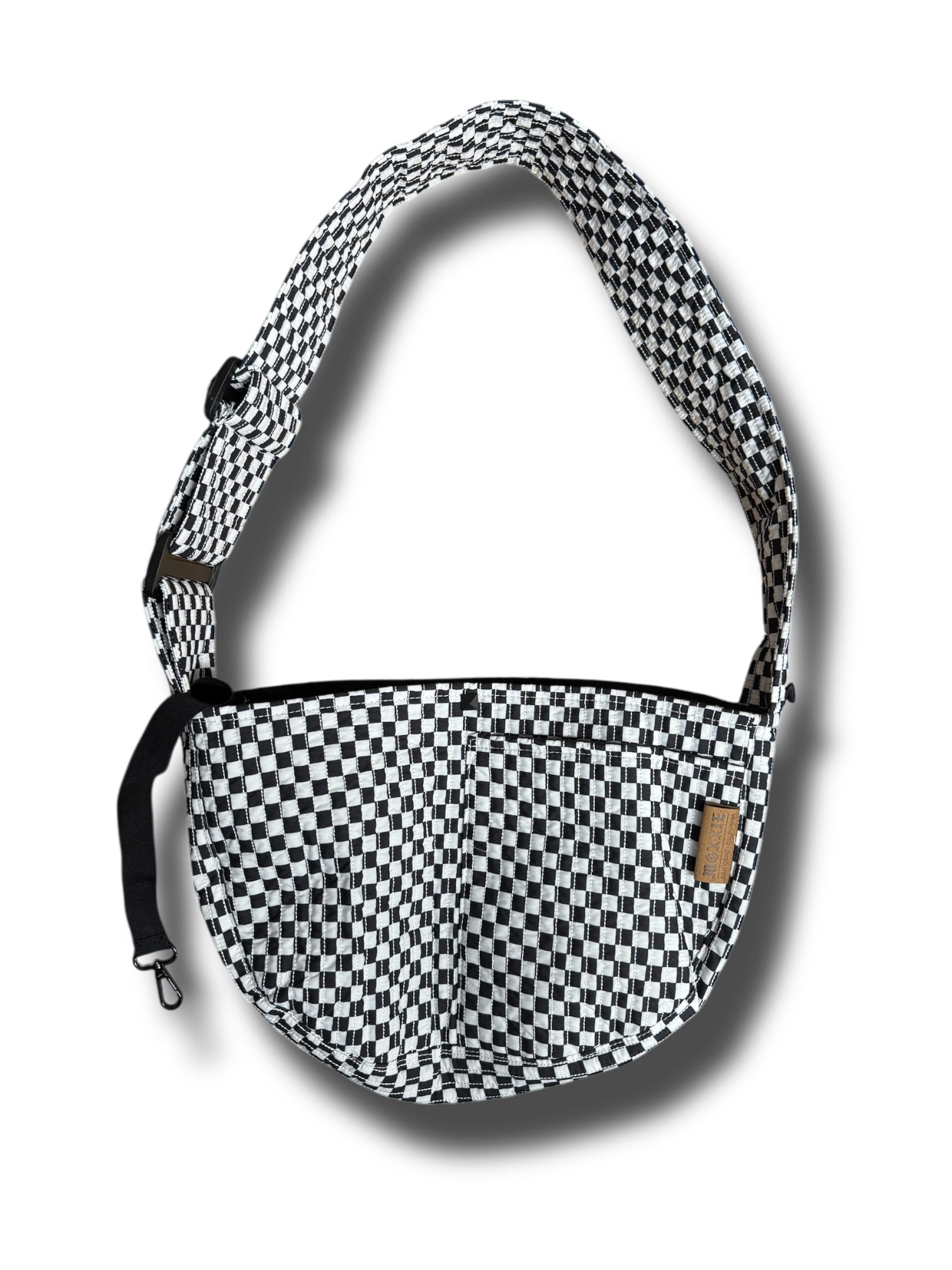 A small dog carrier sling in black and white checkers, designed for hands-free travel and walking. This adjustable, soft, and secure puppy carrier fits dogs and cats weighing 3-10 pounds.