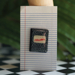 Sad Boy/Sad Girl 'Feelings' notebook pin, a journal-inspired accessory for your emotional journey.