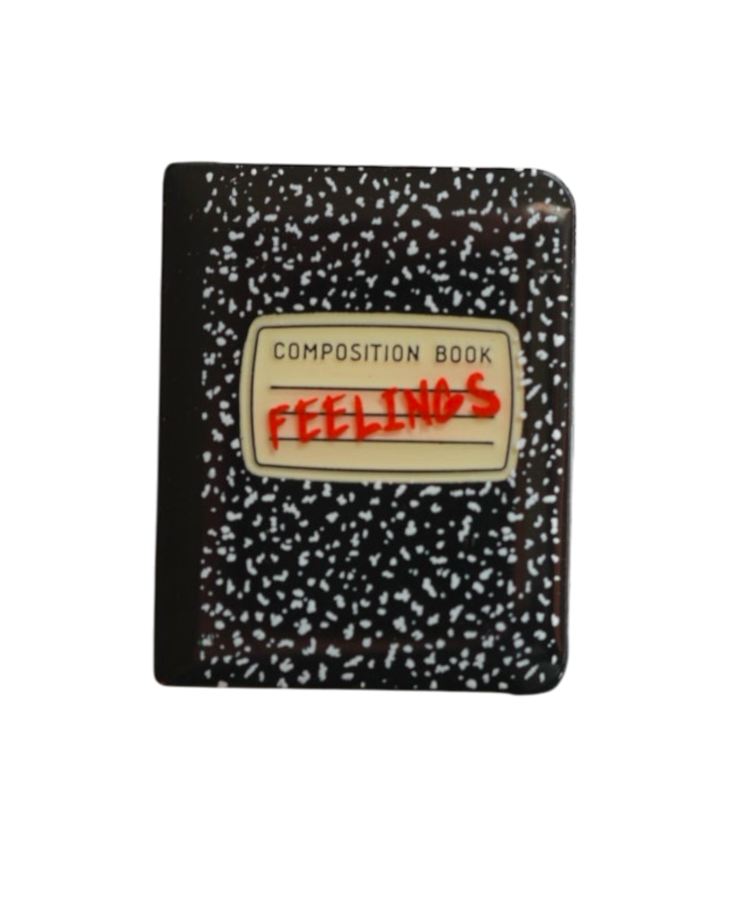 Feelings notebook pin, featuring a composition book design with doodles. 