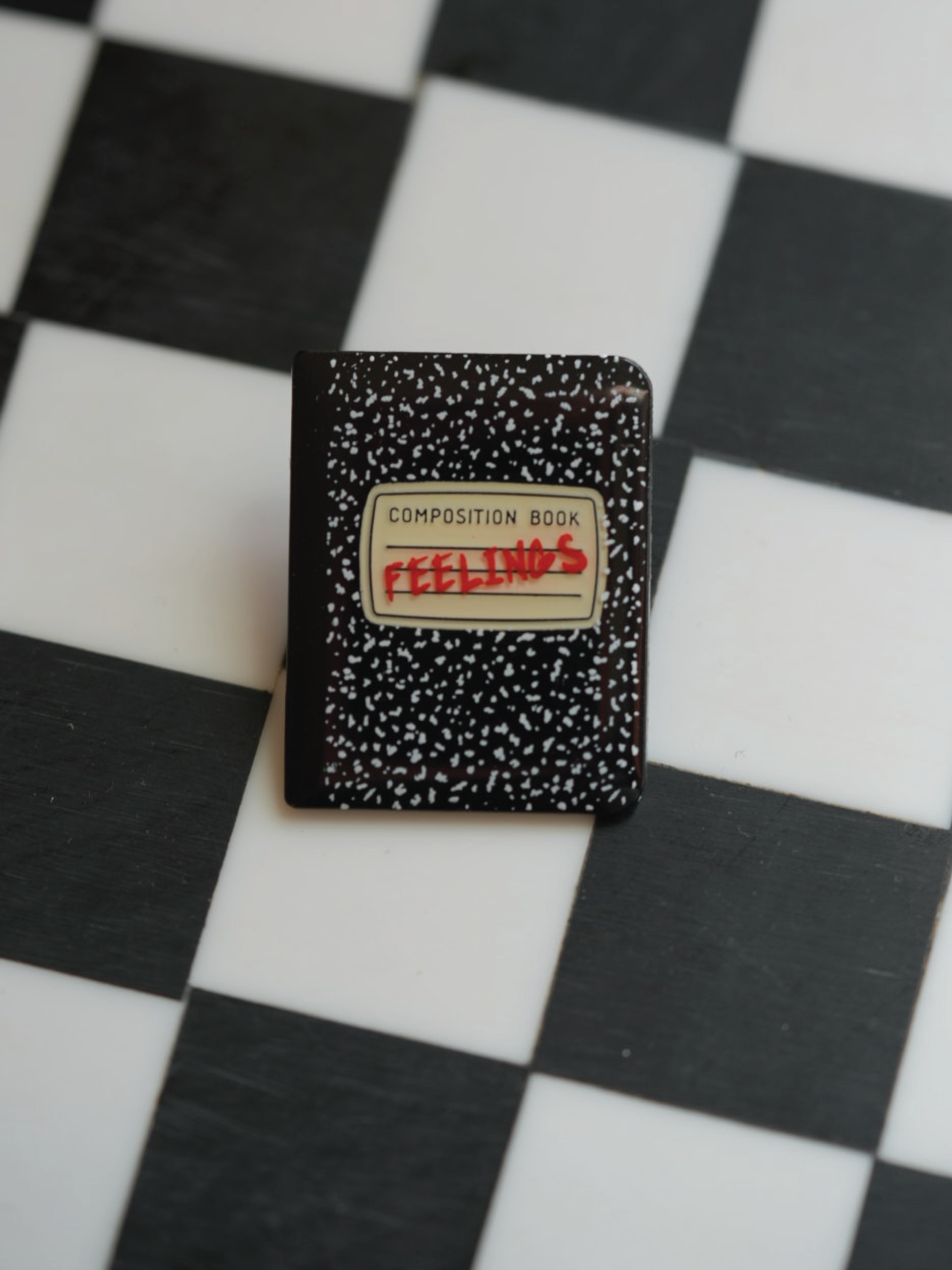 Hide your "FEELINGS" in this composition book pin. 