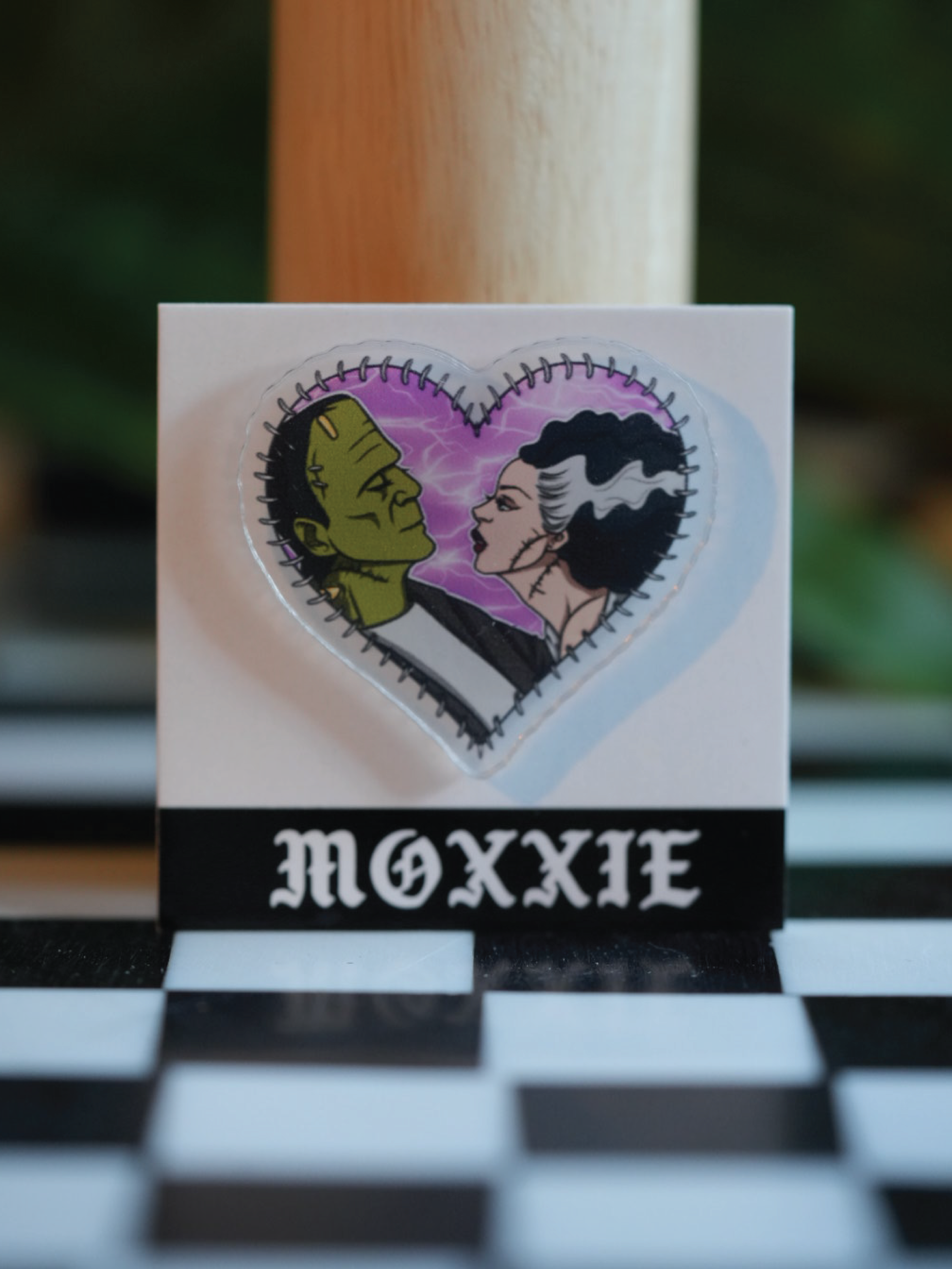 Frankenstein + Bride heart-shaped pin – a spooky, romantic addition to your pin collection for Halloween lovers.