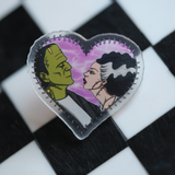 Spooky babe Frankenstein + Bride pin – a must-have for fans of romance and Halloween vibes.