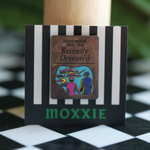 This Beetlejuice 2 enamel pin brings the ghostly vibes of the Handbook for the Recently Deceased to life with spooky charm.