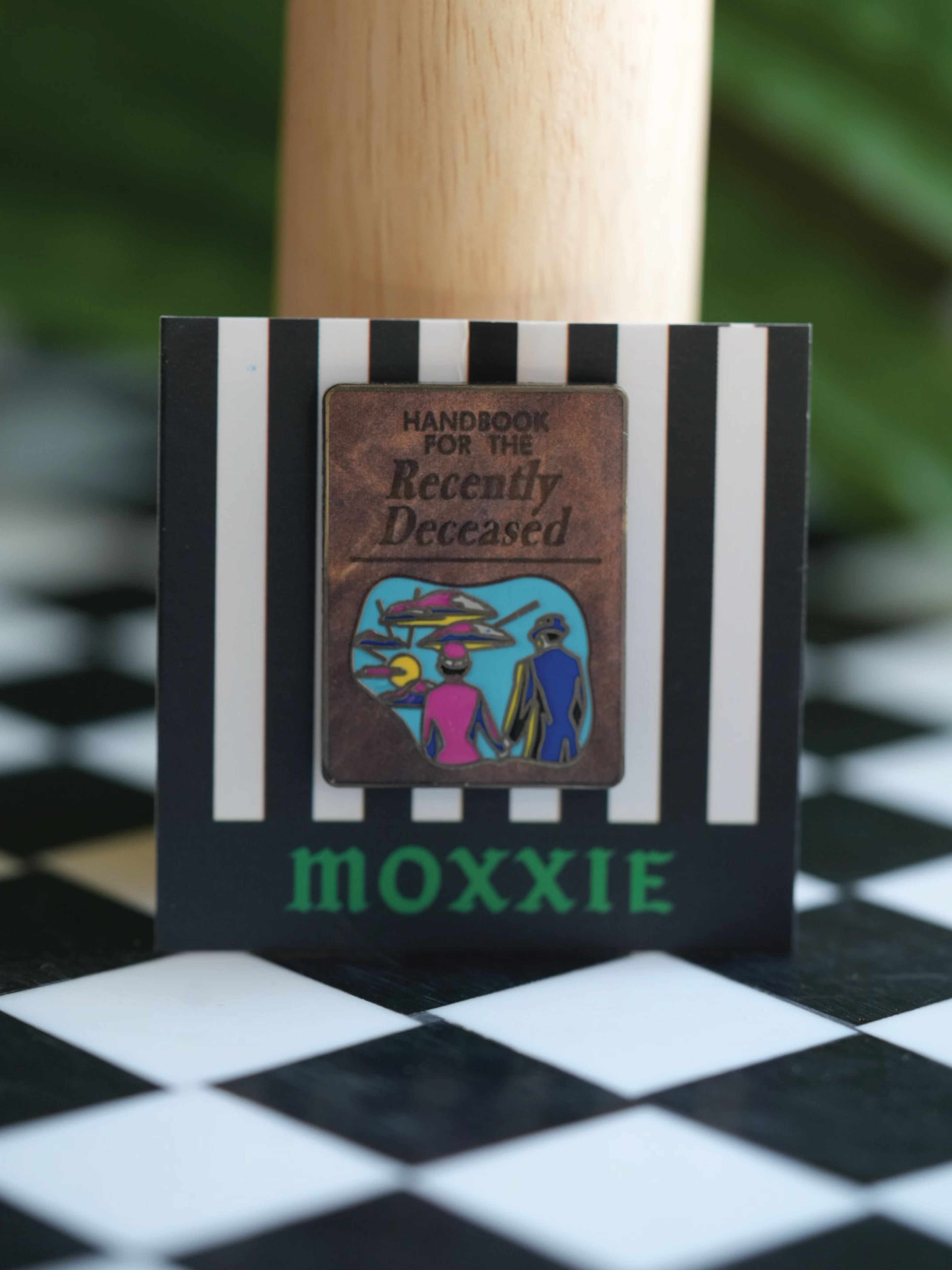 This Beetlejuice 2 enamel pin brings the ghostly vibes of the Handbook for the Recently Deceased to life with spooky charm.