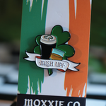 Irish up enamel pin featuring a shamrock, foamy Irish beer and whiskey – perfect for celebrating St. Patrick's Day.