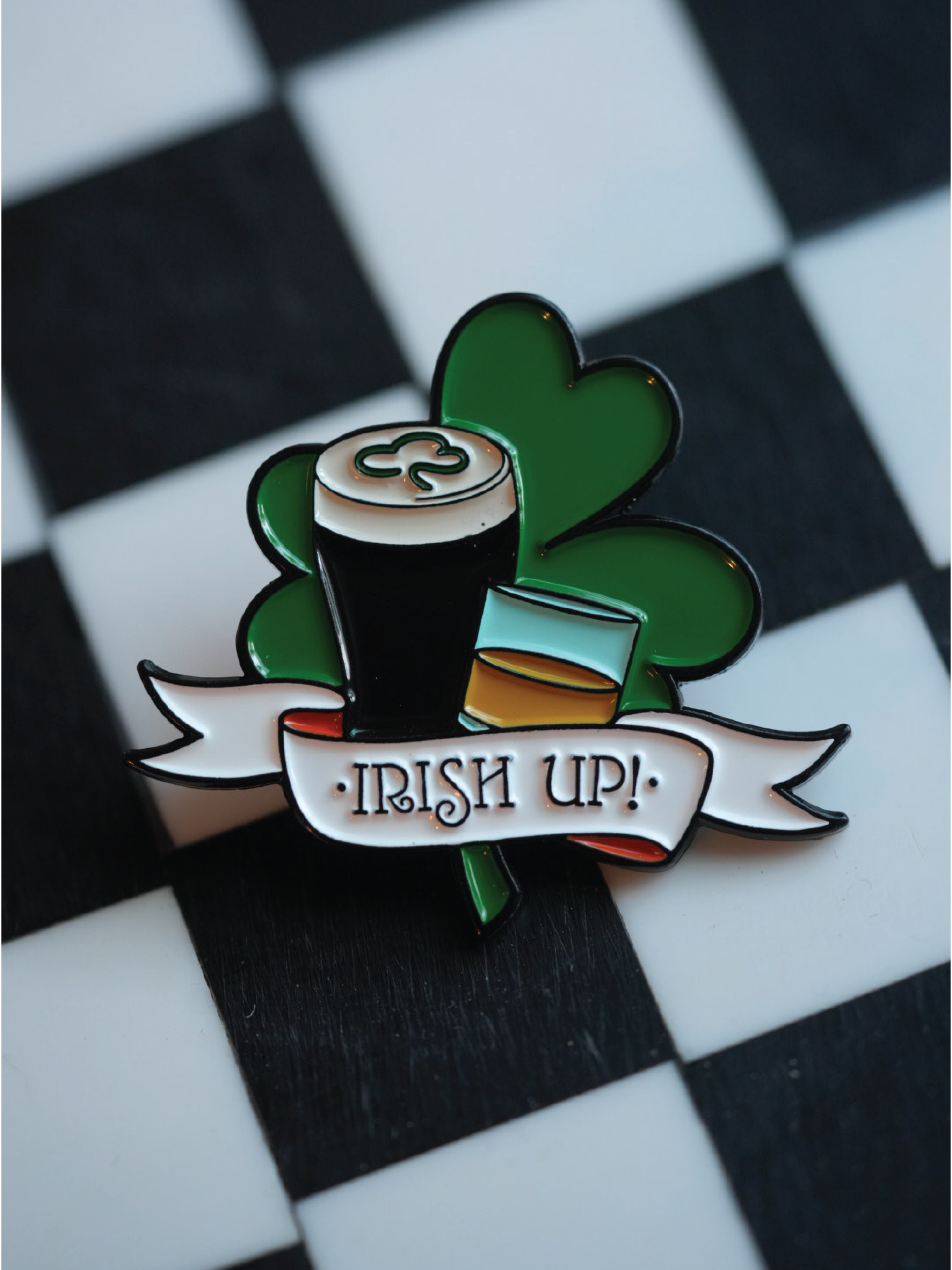 Irish Up! This enamel pin is the perfect accessory for bartenders and Irish whiskey fans on St. Patrick's Day.