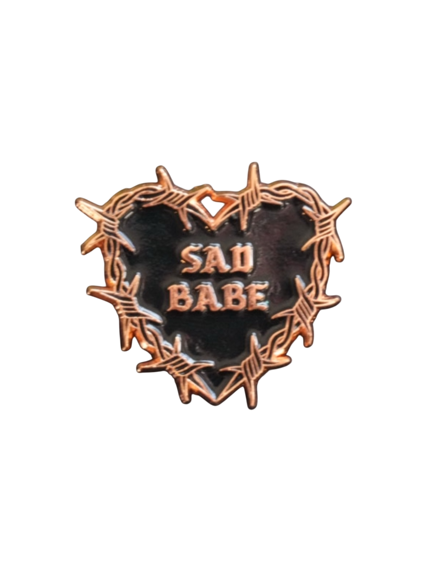 Embrace your sad girl vibes with this Sad Babe pin, featuring a barbed wire heart and classic tattoo art.