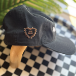 Sad Babe pin with a barbed wire heart and traditional tattoo design adds an edgy, emo touch to a Sad Diego Hat.