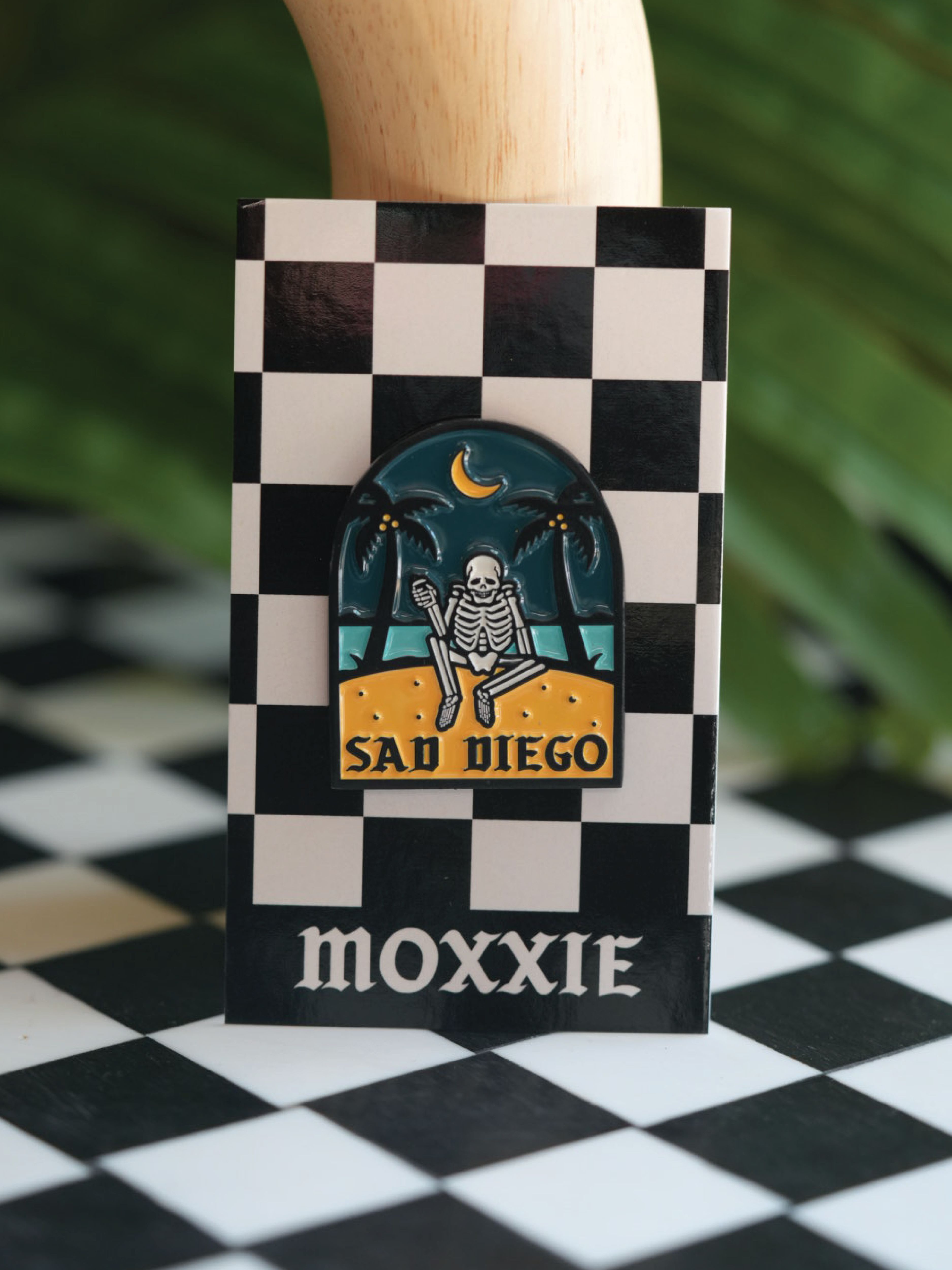 Add a spooky vibe to your pin collection with the Sad Diego pin, blending emo style with a San Diego beach scene. Must have Sad Diego pin! 