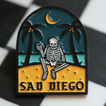Emo-inspired Sad Diego pin with a skeleton and palm trees, adding a unique touch to your pin collection for Emo Night.