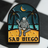 Emo-inspired Sad Diego pin with a skeleton and palm trees, adding a unique touch to your pin collection for Emo Night.