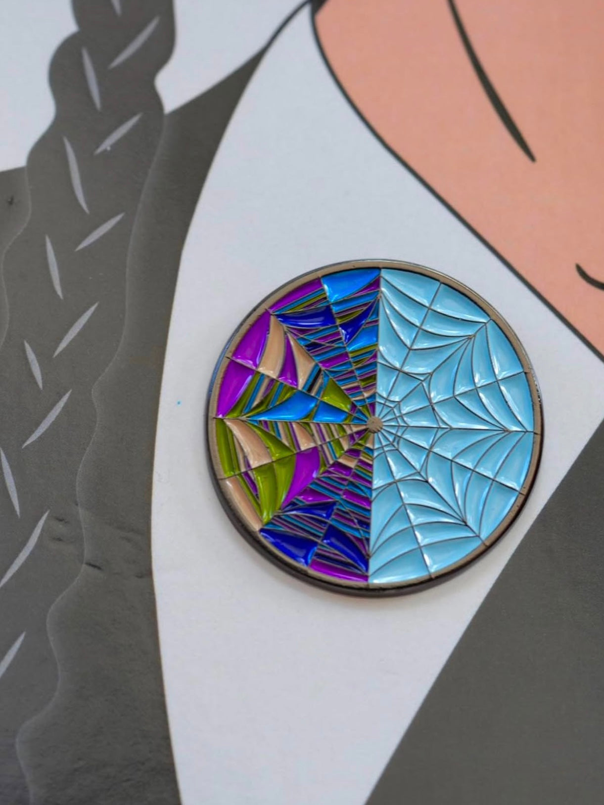 For fans of the Addams Family, this Wednesday Addams pin set is a must-have addition to your spooky pin collection. Close-up image of the spider web window. 