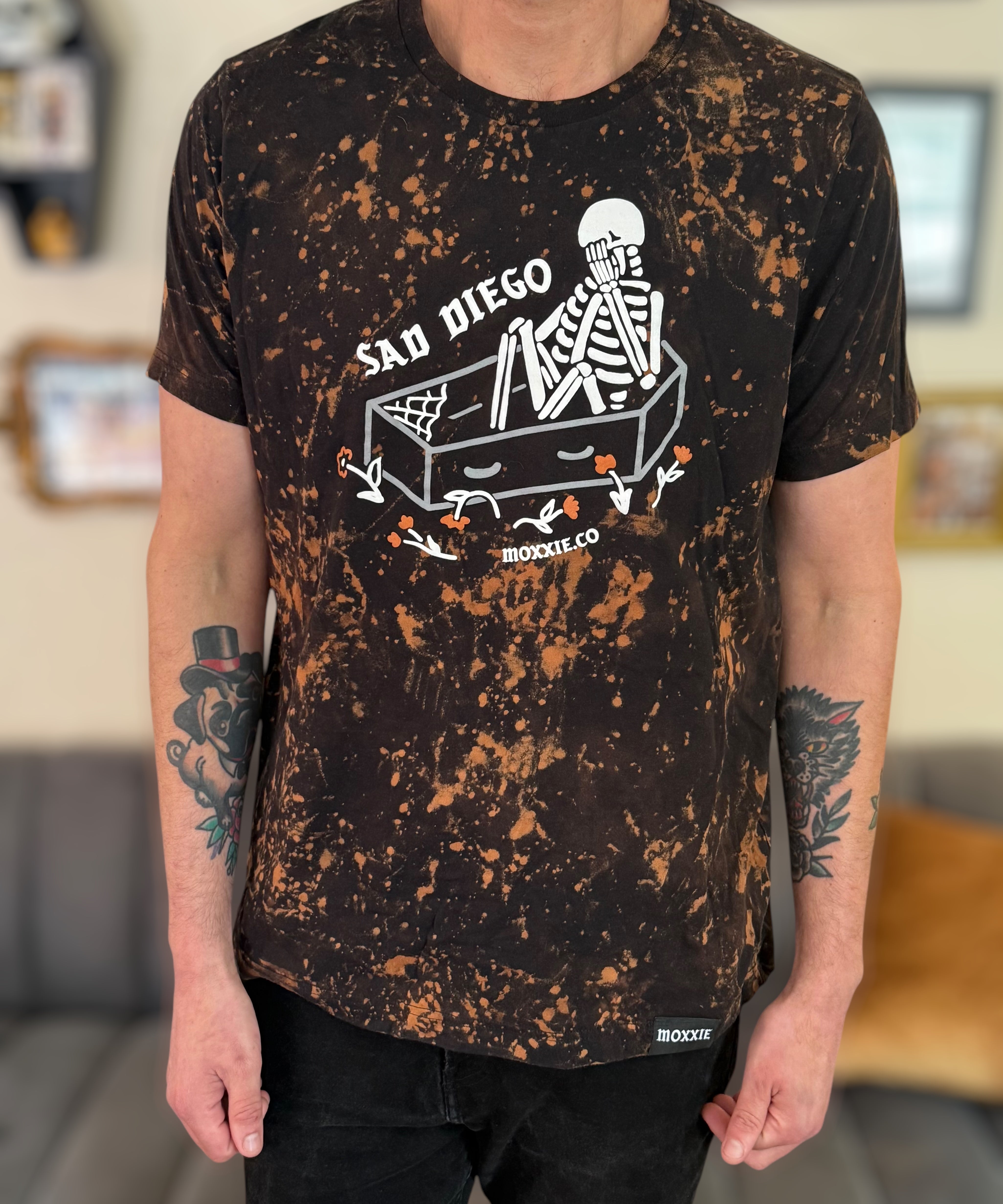 Sad Diego Collection must have! Rock the Emo vibe with a Sad Diego Coffin Bleached Tee, showcasing a skeleton design for a unique look.