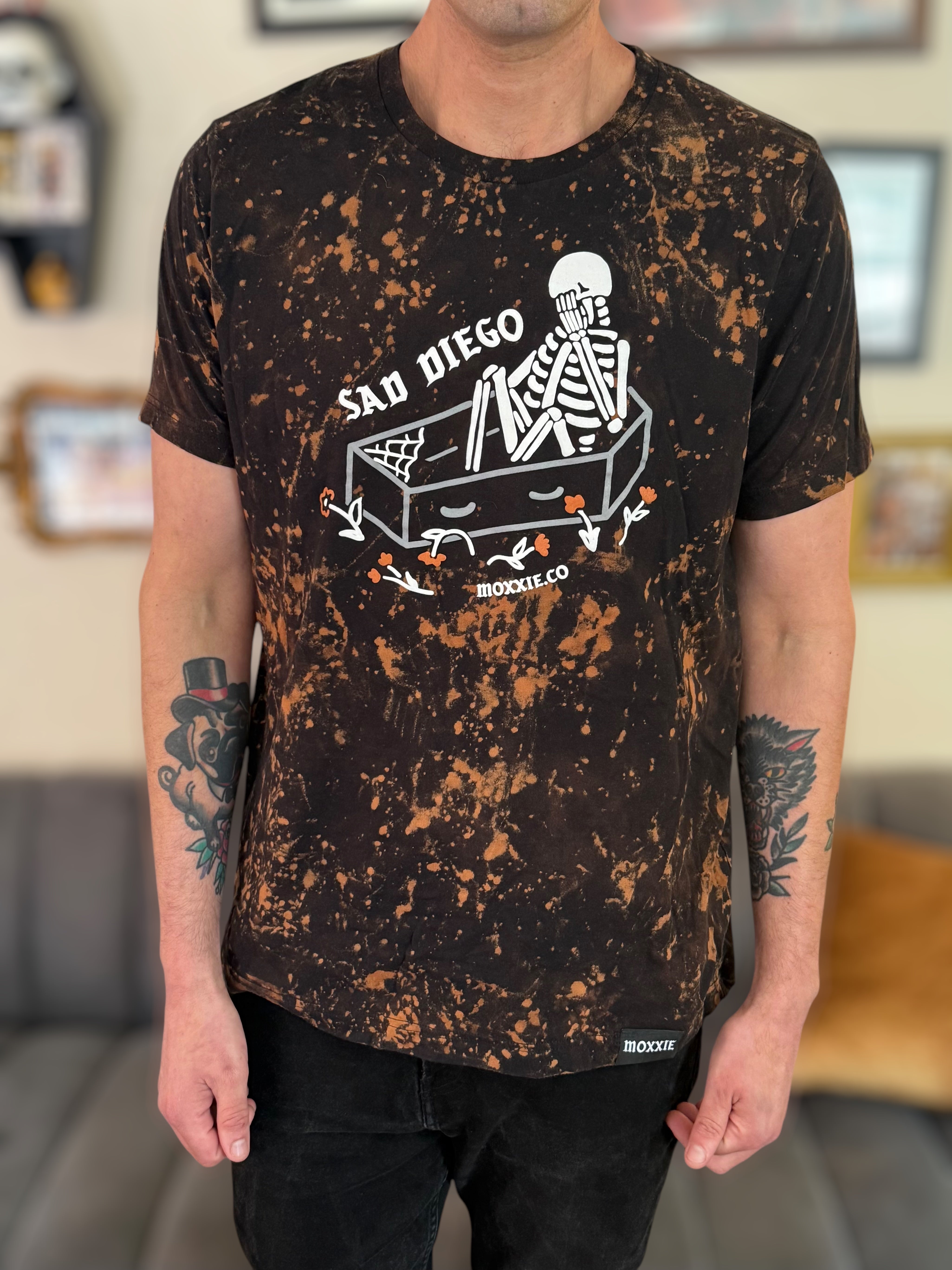 Sad Diego Collection must have! Rock the Emo vibe with a Sad Diego Coffin Bleached Tee, showcasing a skeleton design for a unique look.