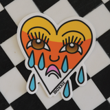 Sad boy/girl crying heart design with candy corn, traditional tattoo-style Halloween sticker.