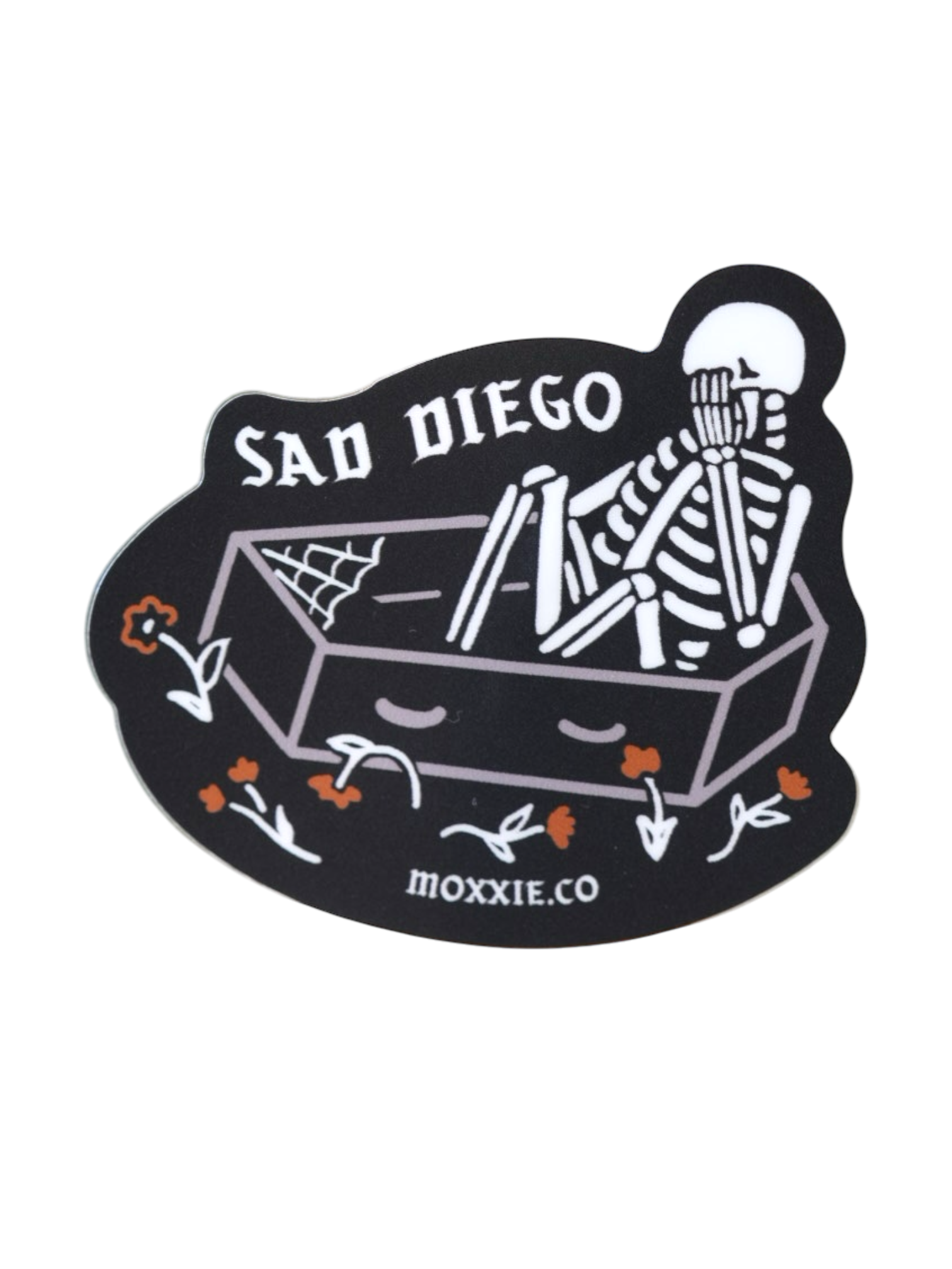 Emo-inspired 'Sad Diego Coffin Sticker' featuring a white skeleton in a coffin, perfect for sad boys, sad girls, and fans of emo nights with its dark, gothic vibe.