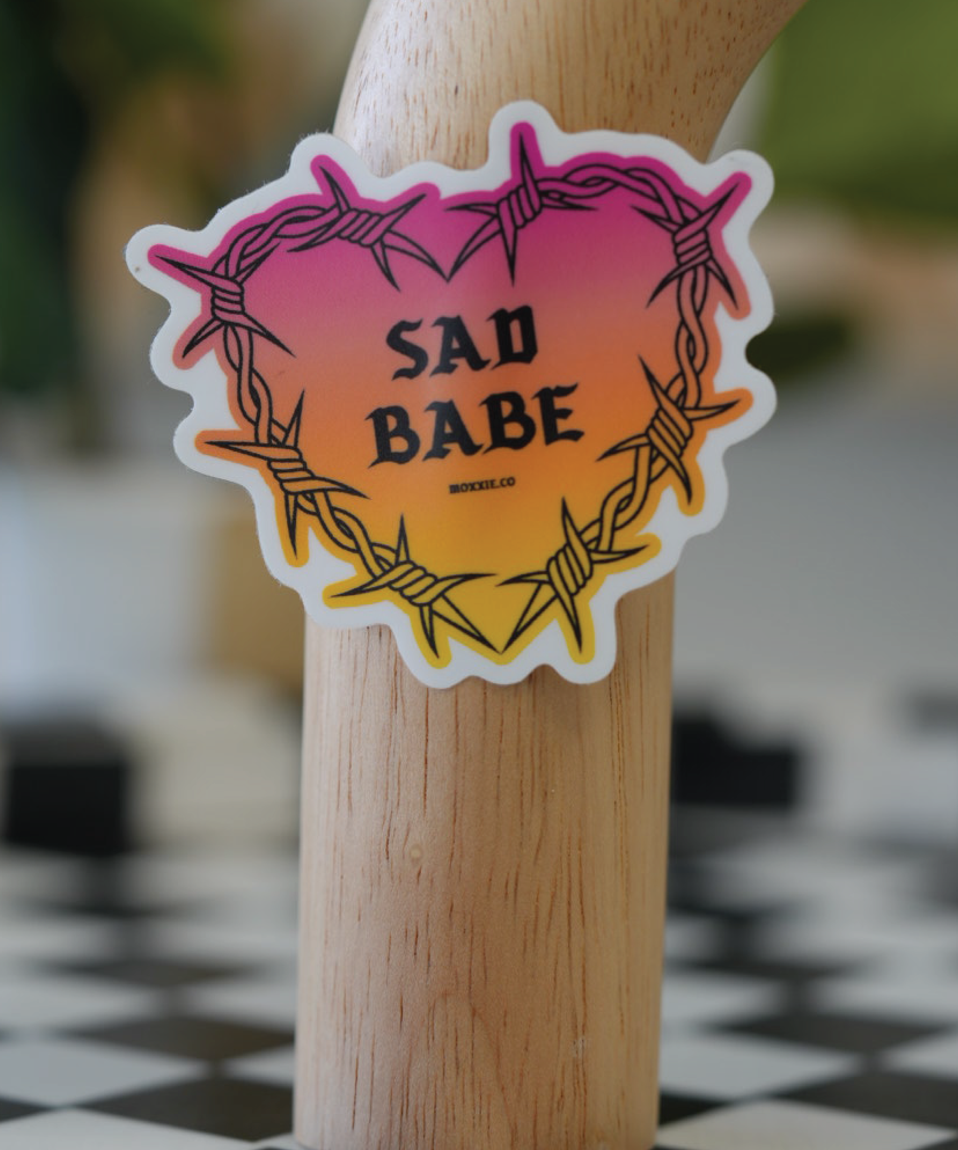 Sad Babe sticker featuring a barbed wire heart design, inspired by traditional tattoos, perfect for sad girls and emo fans.
