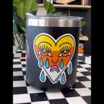Video of a crying heart candy corn sticker on a tumbler, showcasing traditional tattoo-style design. Emo vibes for Halloween, perfect for sad boys and sad girls in San Diego and SoCal.