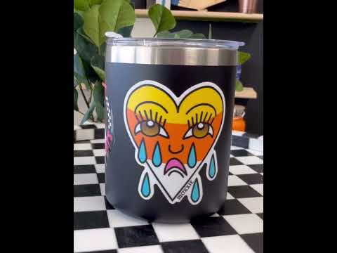 Video of a crying heart candy corn sticker on a tumbler, showcasing traditional tattoo-style design. Emo vibes for Halloween, perfect for sad boys and sad girls in San Diego and SoCal.
