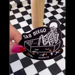 'Sad Diego Coffin Sticker' video, featuring a white skeleton in a coffin, capturing the emo, sad boy, sad girl, and emo night vibes with a gothic, eerie feel.