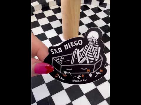 'Sad Diego Coffin Sticker' video, featuring a white skeleton in a coffin, capturing the emo, sad boy, sad girl, and emo night vibes with a gothic, eerie feel.