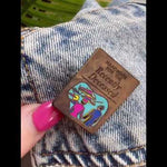 Watch as this spooky Beetlejuice-inspired enamel pin featuring the Handbook for the Recently Deceased adds a haunting touch to a denim jacket, perfect for any horror and Beetlejuice fan.