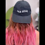 Rock your emo style on the streets of San Diego with the Sad Diego Dad Hat – the ultimate statement piece for your look.